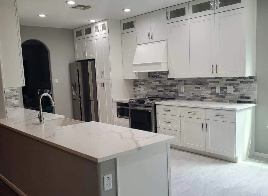 remodeled kitchen with white cabinets
